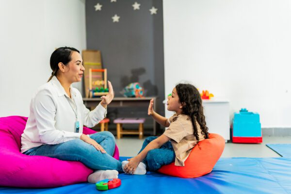 Caregiver interacting with child in CILA facility